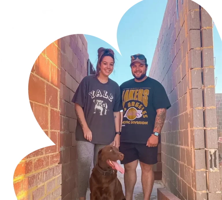 Couple with dog on site at new home la vida homes 1