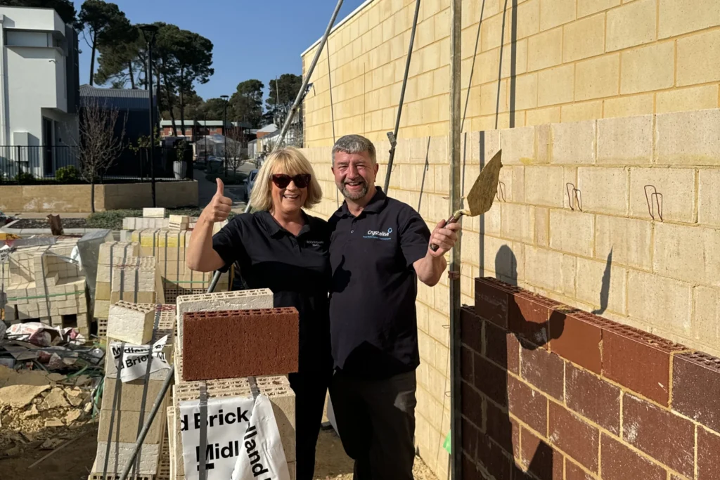 bricklaying experience at new home la vida homes happy couple