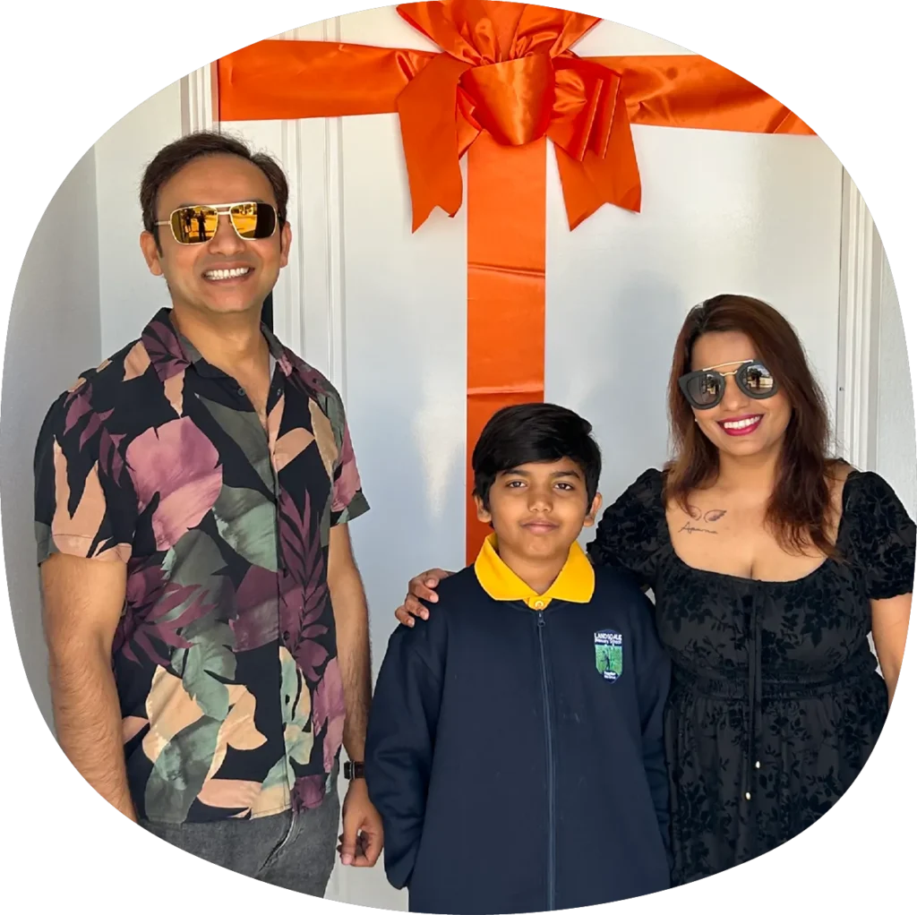 family in front of their la vida home doorbow
