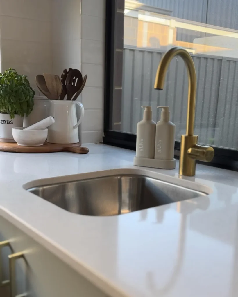 modern la vida homes kitchen with stone benchtop and sink 1